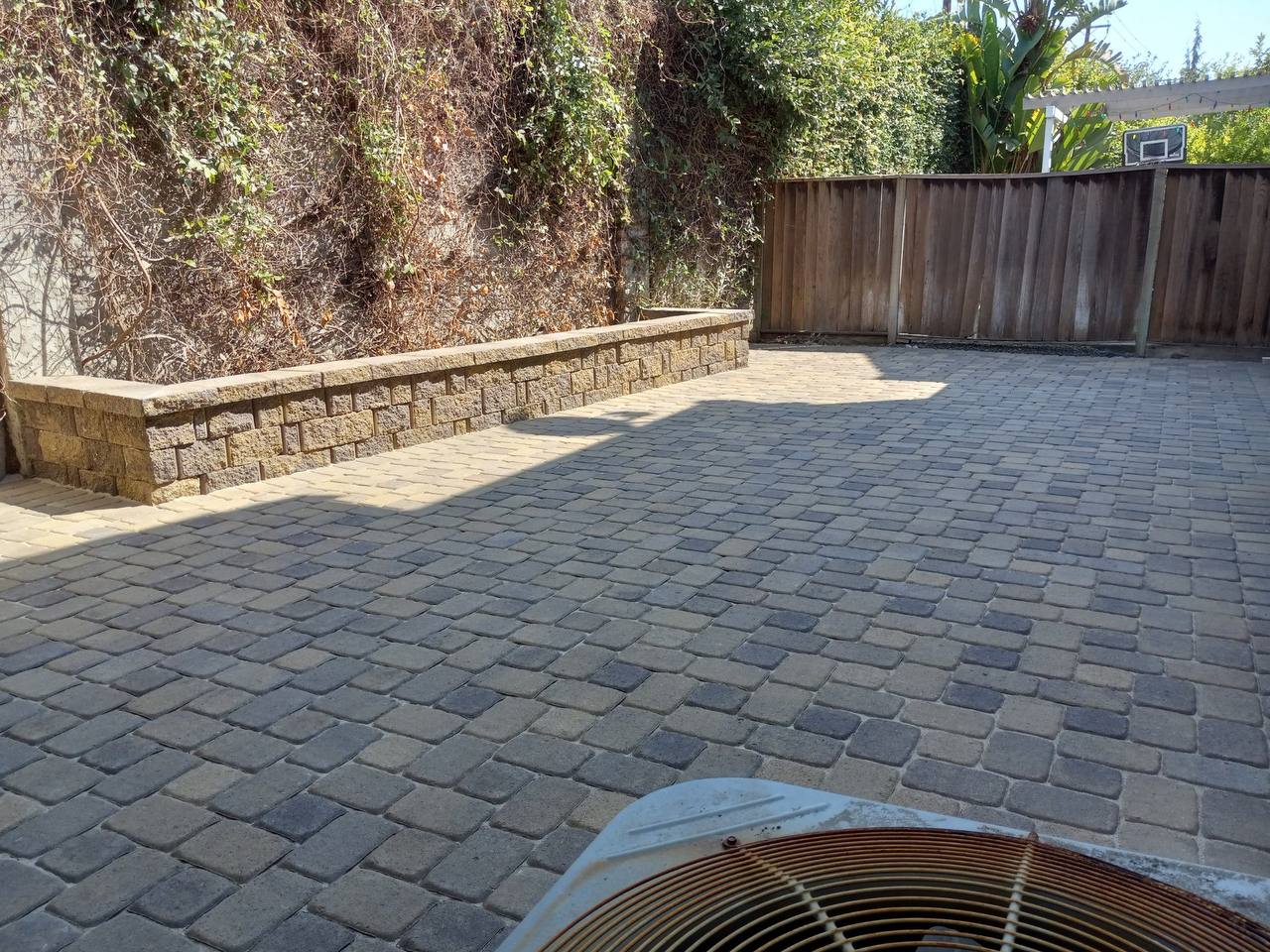 Backyard pavers with retaining wall seating